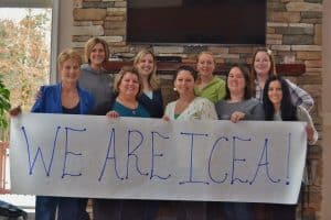 group of women holding we are ICEA banner